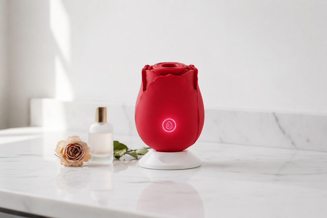 Rose Ritual Massager by ROSE & PULSE on a marble vanity beside a perfume bottle and a dried rose — brand story